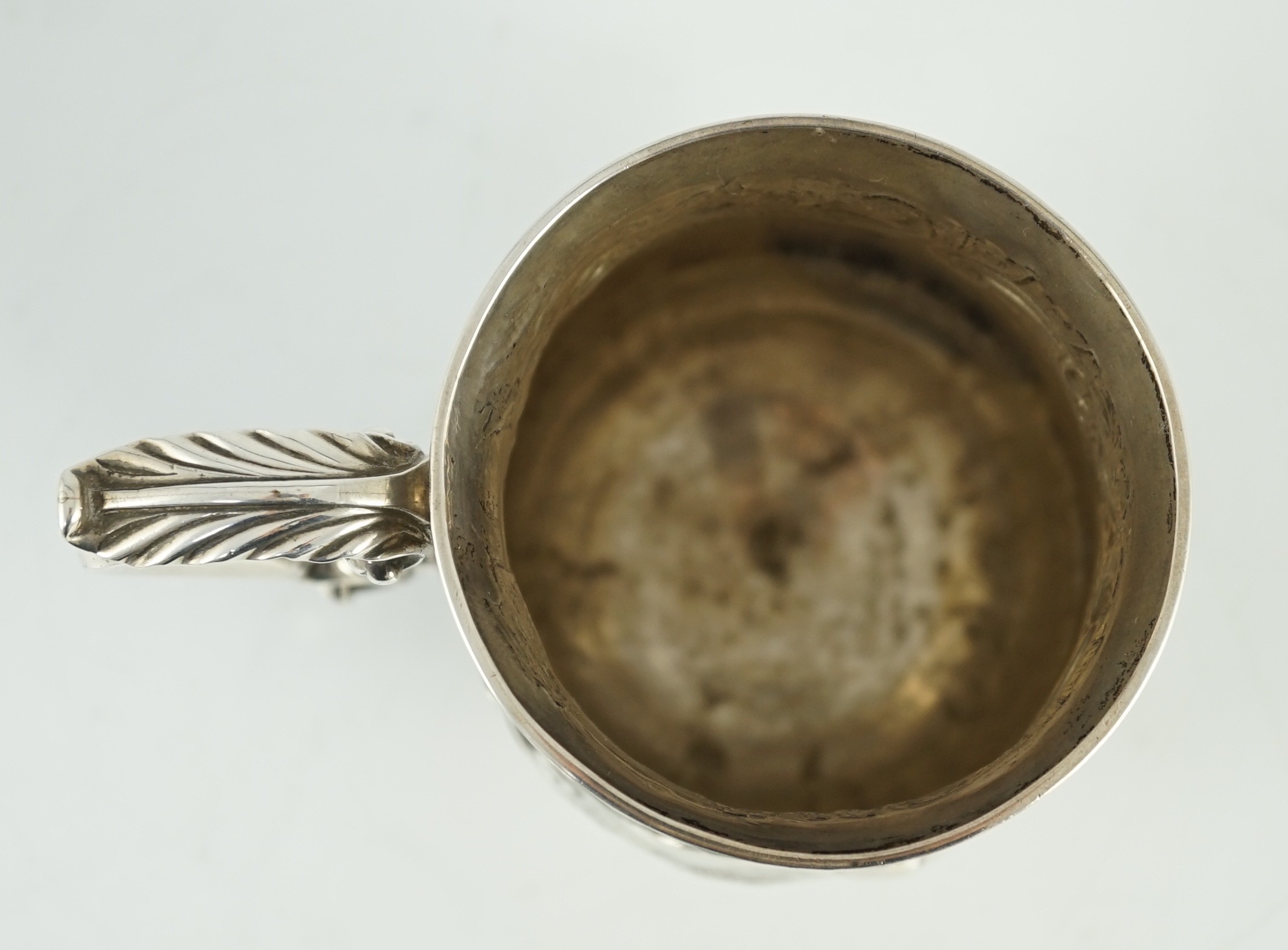 A George III silver baluster mug, later embossed with continuous hare coursing scene, John Scofield